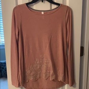 Long sleeve shirt with floral design on the bottom